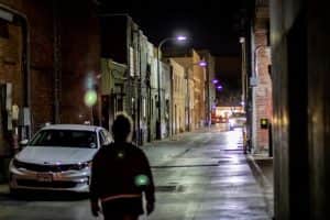 A Person Walking Alone on A Road