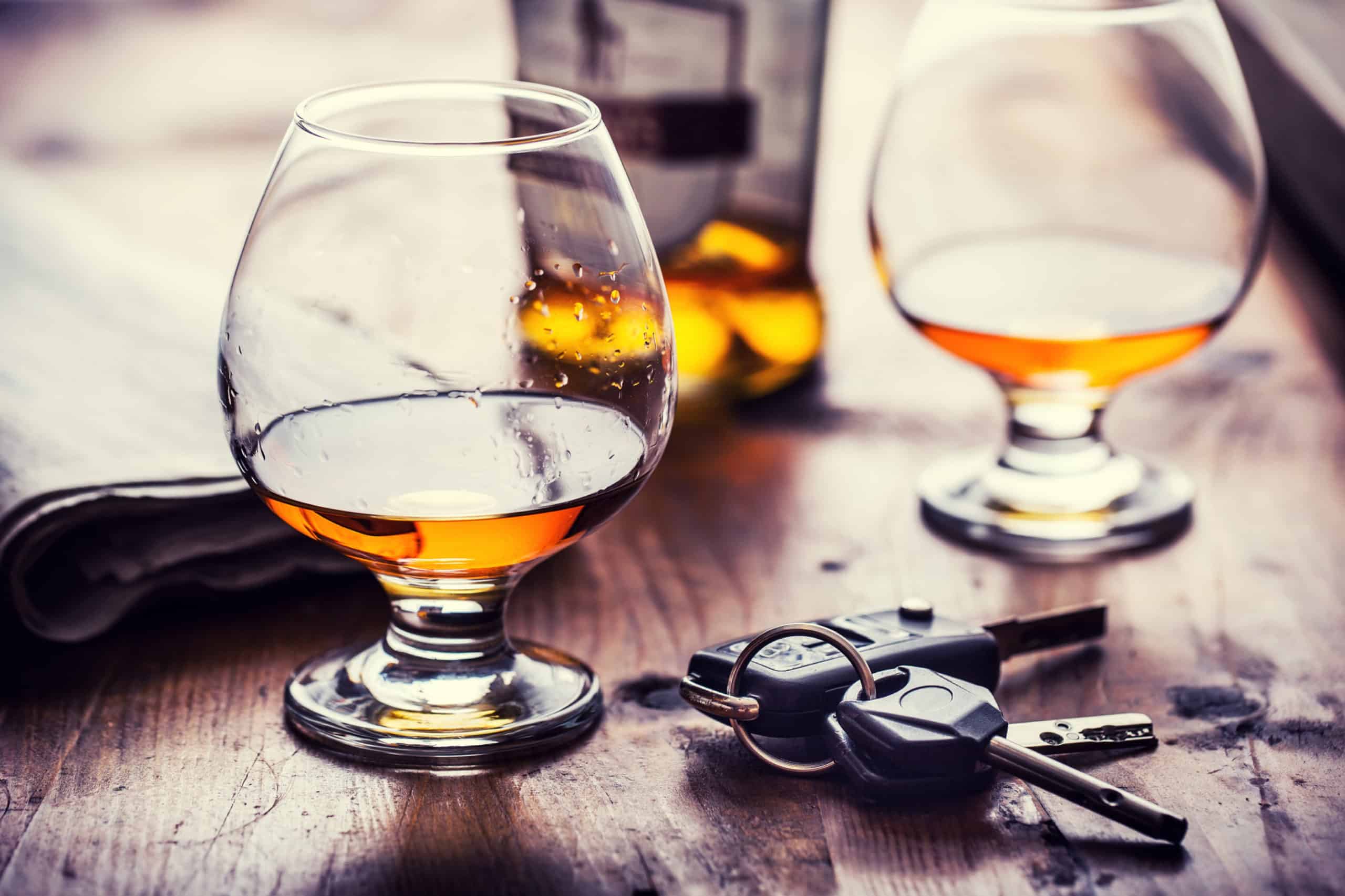 Two Glasses Containing Alcohol With Car Keys on a Table